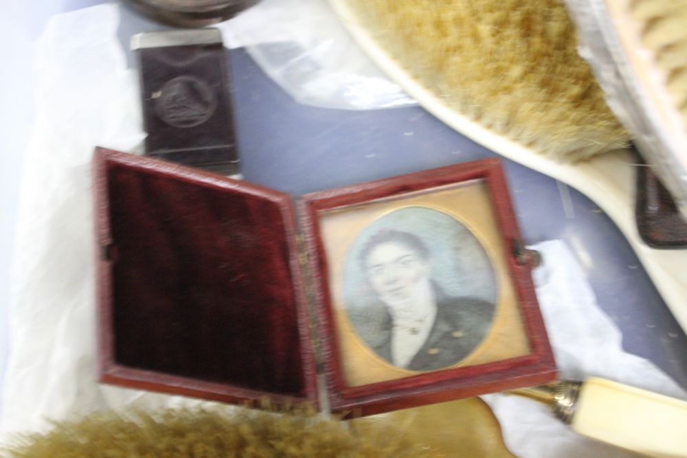 A box of assorted curios including a portrait miniature